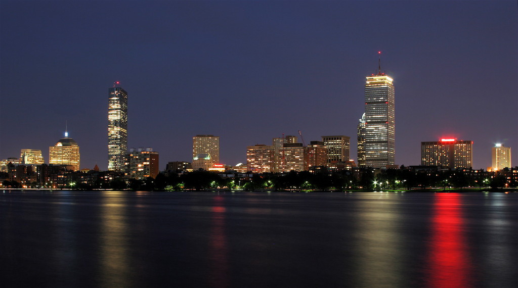 The Boston skyline at night, as seen from Cambridge. (Not as seen from my airplane, from which I was too tired to see much of anything). photo credit: wikimedia.org